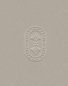 the logo for royal bank on a gray background with an oval emblem in the center