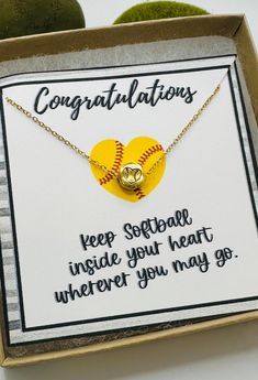 a card with a baseball heart and congratulations written on it