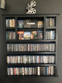 a book shelf filled with lots of movies