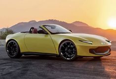 a yellow sports car is parked in the desert