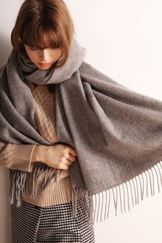 The EMES SHOP scarf is detailed with soft wool material. Features solid color. fringe hem. and long length.MATERIAL:100% BrushedWool Blend Soft Wool, Wool Scarf, Long Length, Solid Color, Wool, Grey, Color