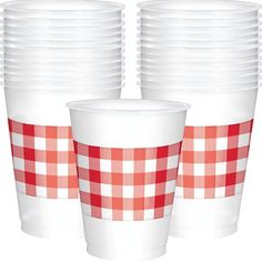 two cups with red and white checkered pattern on them are shown next to each other