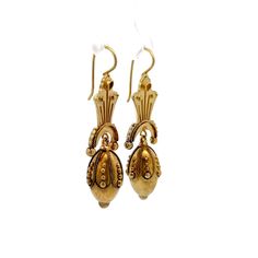 Step back in time with these exquisite Victorian drop earrings, truly a treasure from the 19th century. Crafted in 15 karat yellow gold, these antique earrings showcase the ornate detailing characteristic of the Victorian era. Each earring features intricate scrollwork and hollow elements that contribute to their lightweight feel, making them comfortable for all-day wear. These elegant drop earrings are perfect for anyone who appreciates the beauty of antique jewelry and the rich stories they hold. A timeless set of earrings that add a touch of history and elegance to any outfit! Antique Gold Earrings For Formal Occasions, Yellow Gold Brass Drop Bridal Earrings, Yellow Gold Drop Bridal Earrings In Brass, Antique Gold Victorian Earrings For Formal Occasions, Antique Gold Victorian Earrings For Formal Events, Victorian Engraved Earrings For Formal Occasions, Victorian Antique Gold Earrings For Formal Occasions, Ornate Filigree Plug Earrings, Traditional Yellow Gold Chandelier Earrings For Formal Occasions