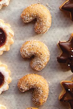 various pastries are arranged on a baking sheet