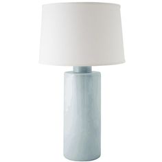 a light blue table lamp with a white shade on the top and bottom part of it