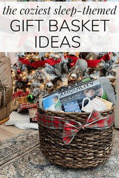 a basket filled with books next to a christmas tree