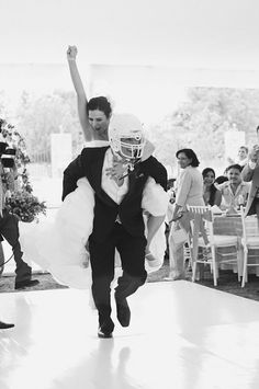 the bride and groom are walking down the aisle