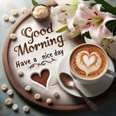 there is a cup of coffee and some flowers on the tray with good morning have a nice day