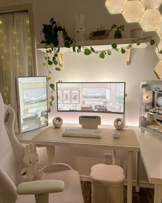 a computer desk with two monitors and a keyboard