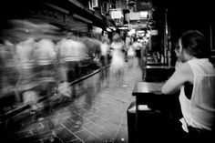 blurry photograph of people sitting at tables in a restaurant