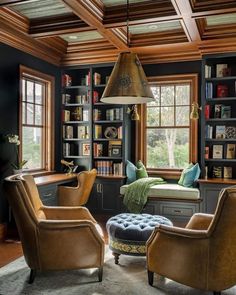 a living room filled with furniture and bookshelves next to a window covered in lots of books