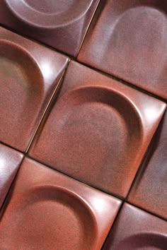 a close up view of some brown tiles