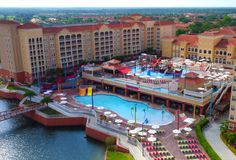 an aerial view of a resort with a pool and water park in the middle of it