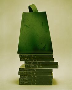 a stack of books sitting on top of each other in front of a white background