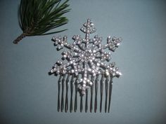 a close up of a hair comb with snowflakes on it