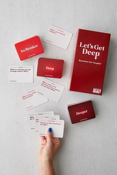 a person is holding up some cards with the words let's get deep written on them