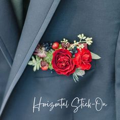 a man in a blue suit with red flowers and berries on his lapel pin