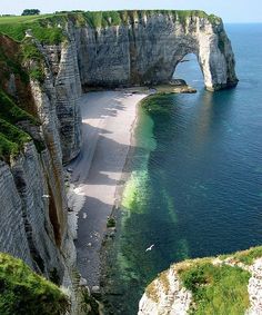 an aerial view of the beach and cliffs