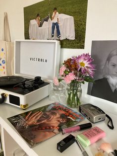 a white table topped with pictures and flowers