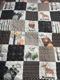 a quilt with animals on it and words written in different languages that say be strong