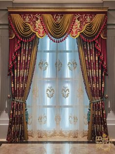 an elegant window with red and gold curtains