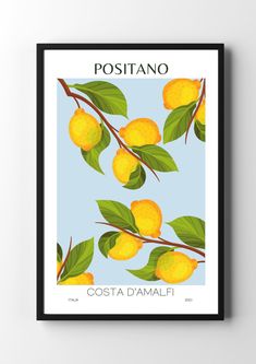 a poster with some lemons hanging on a wall next to a black framed frame