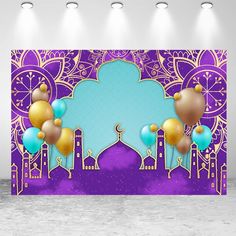 a purple and gold backdrop with balloons in front of an ornate design on the wall