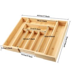 a wooden tray with compartments and measurements