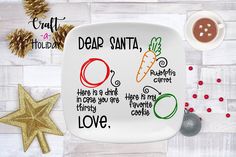 a white plate with some writing on it next to christmas decorations and other holiday items