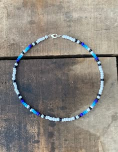 Blue Skies Serape Necklace! Beaded necklace that features silver platted clasps to help prevent tarnish. Also features a double O-Ring to ensure the necklace stays closed and secure. Length: 14 In Blue Jewelry With Lobster Clasp For Festival, Blue Beaded Necklaces With Lobster Clasp For Festival, Blue Beaded Necklace For Festival With Lobster Clasp, Blue Single Strand Choker Jewelry, Blue Single Strand Choker For Gift, Adjustable Blue Beaded Necklace With Lobster Clasp, Adjustable Blue Necklace With Silver Beads, Blue Single Strand Beaded Necklace For Festival, Blue Single Strand Choker With Round Beads