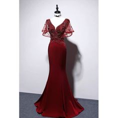 This Burgundy V-neck Mermaid Evening Gown is perfect for making a statement at any special occasion. The fitted silhouette features a deep V neckline and a ruffle detail that cascades down the body of the dress. The mermaid silhouette hugs the body to showcase your curves while the floor-length skirt adds a touch of drama. The beautiful burgundy color adds a classic elegance to the dress. This gorgeous dress is also available in plus sizes to ensure that everybody can look and feel their best Burgundy Dress Long, Ruffle Formal Dress, Formal Dress Plus Size, Dark Dresses, Victorian Style Wedding Dress, Burgundy Wedding Dress, Dark Lighting, Nontraditional Wedding Dress, Red Clothing