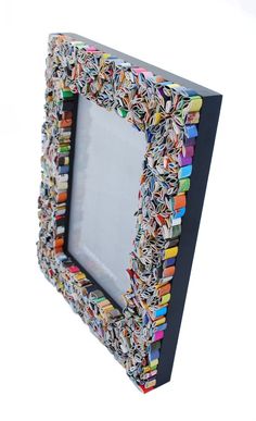 a multicolored photo frame made out of books