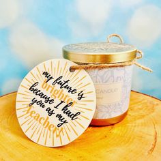 a jar of yogurt sitting on top of a wooden table next to a tag