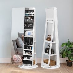 two white shelving stands in front of a mirror