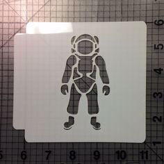 a white sticker with an image of a man in space suit on it's side