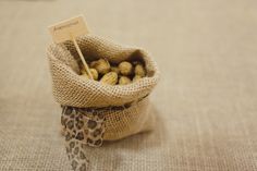 a bag filled with nuts sitting on top of a table