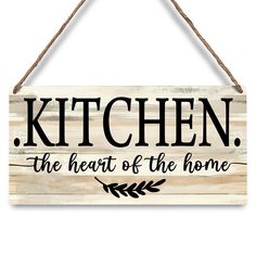 a wooden sign that says kitchen the heart of the home