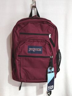 This JanSport Big Student backpack is roomy enough for all your essentials.  NOTE:   Last picture is used only to show the compartments of the backpack.   PRODUCT FEATURES Dedicated 15" padded laptop compartment Side water bottle pocket Two large main compartments Ergonomic S-curve shoulder straps Front utility pocket with organizer Pleated front stash pocket Zippered front stash pocket Fully padded back panel Ergonomic S-curve shoulder straps Web haul handle PRODUCT DETAILS 17.5"H x 13"W x 10"D Red Jansport Backpack, Jansport Backpacks Big Student, Red Laptop, Cute Backpacks, School Essentials, Student Backpacks, Jansport Backpack, Womens Backpack, Front Zipper