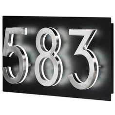 a metal sign with numbers on it