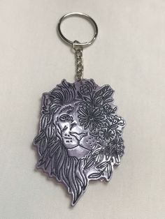 "This is a Lion handmade resin keychain. They are purple, black, clear. The lion is 3\" long and 2\" wide. The whole length with the ring and chain is 5\". They are durable but don't leave in heat for too long because resin can warp. Feel free to contact me with any questions or concerns. Please check out my store for more handmade and vintage items." Zodiac Flowers, Lion Keychain, Jungle Lion, Leather Keychains, King Of The Jungle, Flowers Handmade, Leo Zodiac, Leave In, Purple And Black