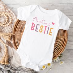 Auntie's bestie baby bodysuit. This cute little suit will be sure to impress! Bodysuit is 100% cotton.  We design & print our products with care & love! We use the best quality vinyls, inks & transfers on all products. * * * * * * * * * * * * * * * * * * * * * * * * * * * * * SHIPPING: We want to get your product to you as quickly as possible, your purchase will be shipped through Australia post, Express post is available for selection. * * * * * * * * * * * * * * * * * * * * * * * * * * * * * G Aunties Bestie, Aunt Pregnancy Announcement, Auntie Baby, Auntie Gifts, Australia Post, Ink Transfer, Baby Body, Gender Neutral Baby, Pregnancy Announcement