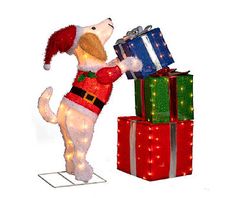 a dog is standing next to presents on a white background and has his paws in the air