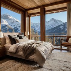 a bedroom with a large window overlooking the mountains