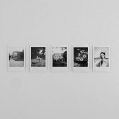 four polaroid photographs hanging on the wall in front of a white wall with five different pictures