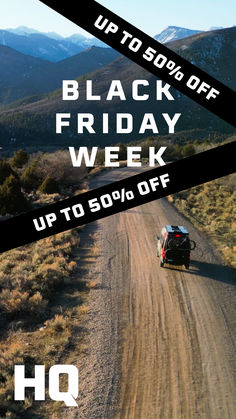 a car driving down a dirt road with the words black friday week up to 50 % off