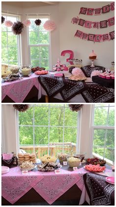 the table is set up with pink and black desserts, cupcakes, and cake