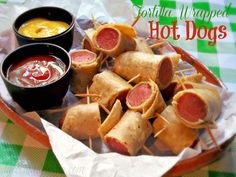 hot dogs are wrapped in bread and served with dipping sauce