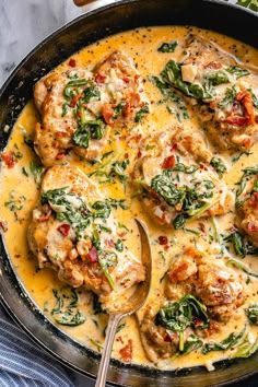 chicken with spinach and cheese in a skillet