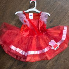 This Cute Little Peppa Pig Costume Has A Velour Botice And A Sparkly Mesh Over Lining Skirt. Nwot Dress Only. However, There Is A Piece Of Velcro In Back To Attach A Tail. There Isn’t A Size Tag But Will Fit Size 18 Months To 2t. Peppa Pig Costume, Pig Costume, Pig Costumes, Peppa Pig, Size Tag, Kids Costumes, Mesh, Skirt, Red