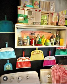 the shelves are filled with colorful kitchen items